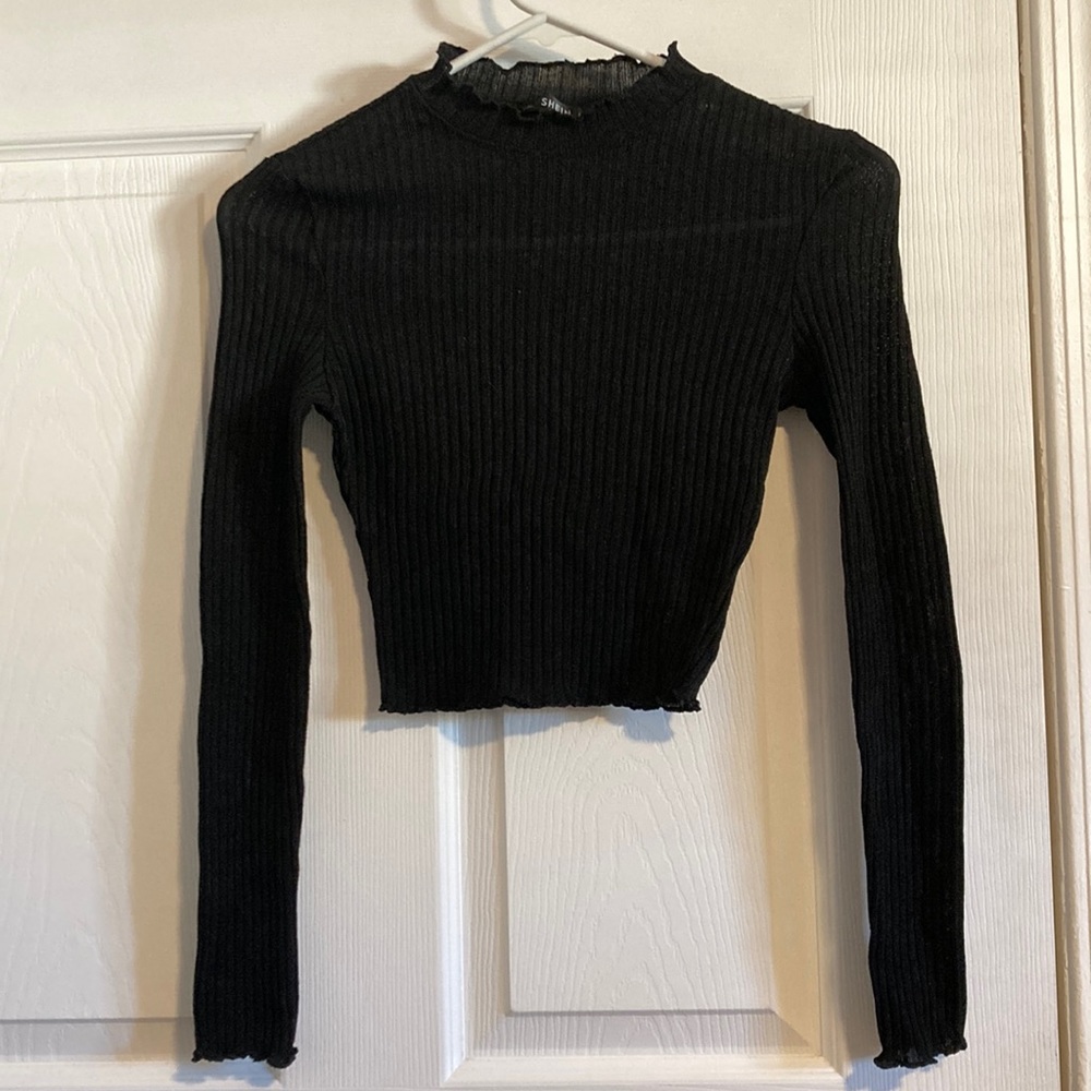 Black long sleeve top , but is very see thru